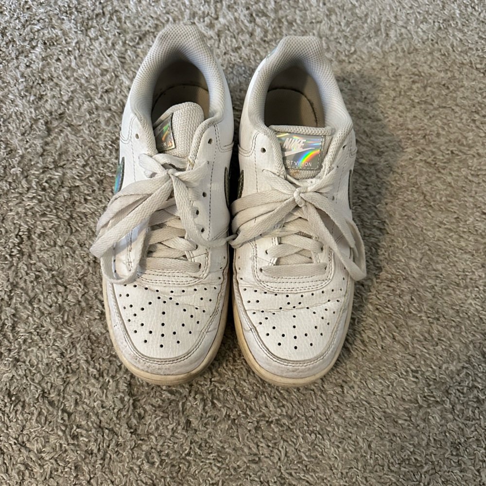 Nike sneakers with iridescent swoosh